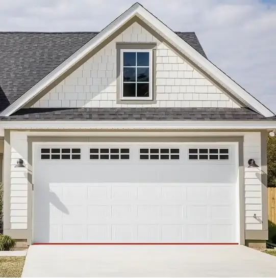 Two-car garage with a closed white panel door at the front of a house